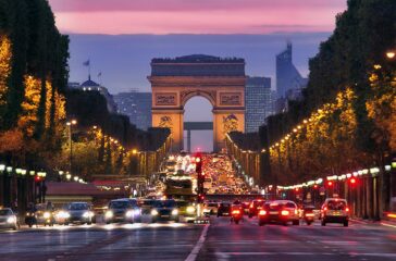 Champs Elysees and Arc de Triomphe in Paris France. night scene with car traffic