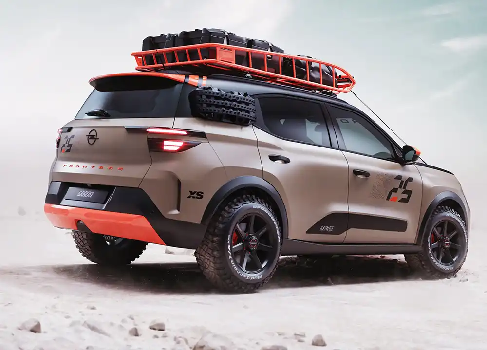 Unter anderem ein besonders robuster Dachgepäckträger verleiht dem Umbau einen Abenteuer-Look. Foto: Opel