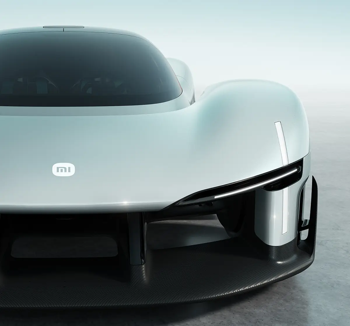 Nahaufnahme der Frontpartie mit dem beleuchteten Mi-Logo und den präzise in die Karosserie eingearbeiteten Aerodynamik-Kanälen. Foto: Xiaomi