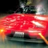 Roter Nissan 300ZX Turbo von 1986 in Fahrt, ein Symbol der japanischen Sportwagen-Offensive.