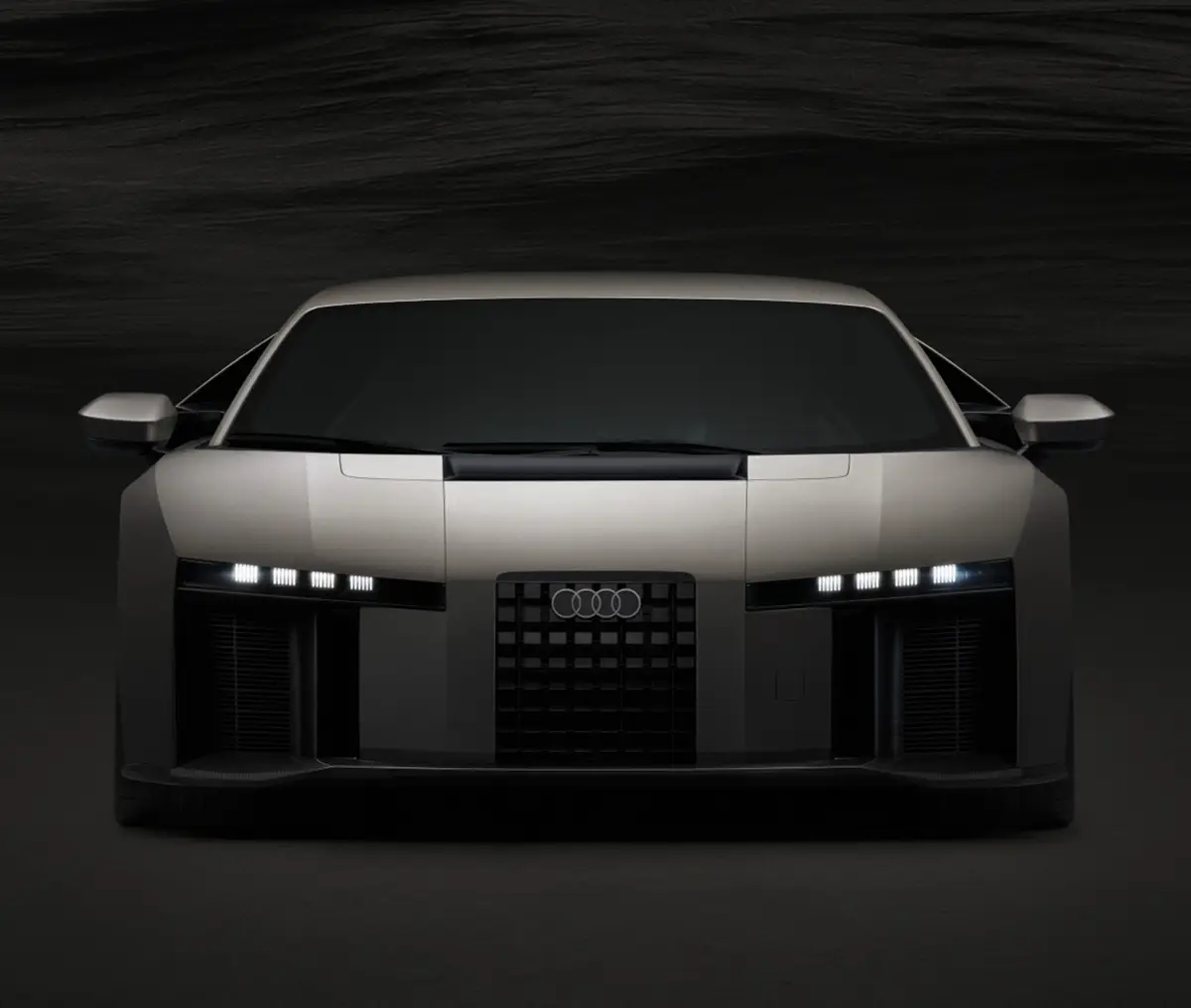 Die direkte Frontalansicht des Audi Nuvolari zur Demonstration der neuen Lichtsignatur mit vier horizontalen LED-Elementen und den zentral platzierten Audi-Ringen.