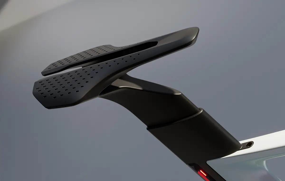 Detailaufnahme der aerodynamisch geformten, schwarzen Carbon-Sattelstütze des Canyon Predict, die mit einer automatischen Absenkfunktion zur Schwerpunktabsenkung ausgestattet ist.