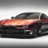Frontdreiviertelansicht des kupferrot schimmernden Aston Martin Valen mit tiefem Frontsplitter und schmalen Scheinwerfern im Fotostudio